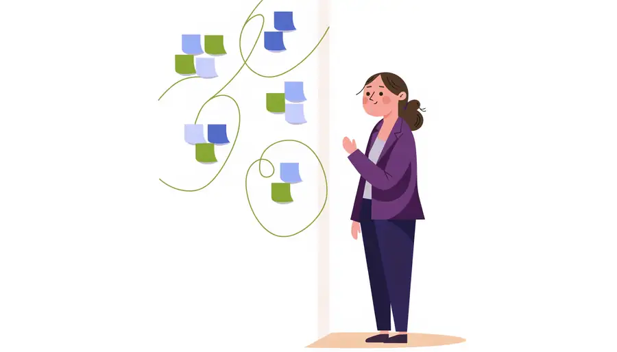Studying four clusters of notes on a wall and connecting them